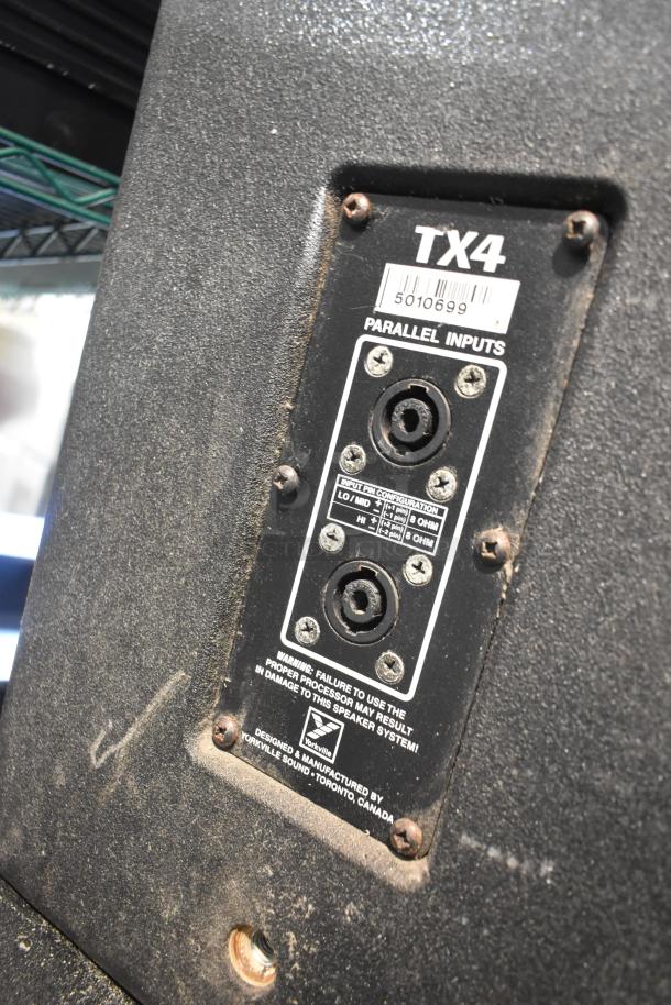 Yorkville TX4 speaker input panel showing parallel inputs, pin configuration, and manufacturer label. Slightly dusty condition.