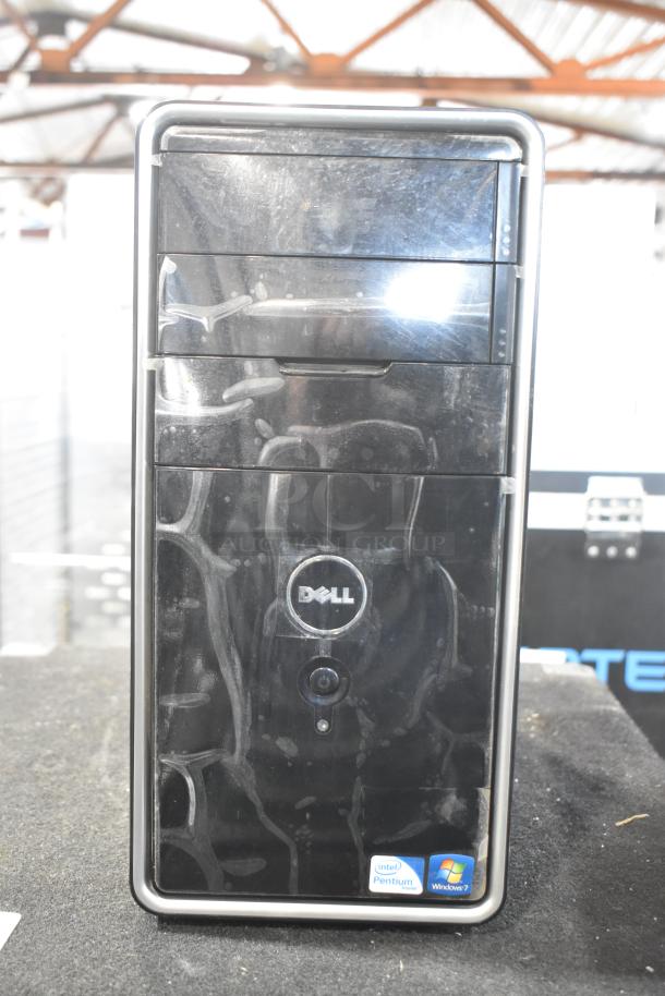 Dell DCMF computer tower, black, 115/230 volts, single-phase. Visible Intel Pentium and Windows 7 stickers.