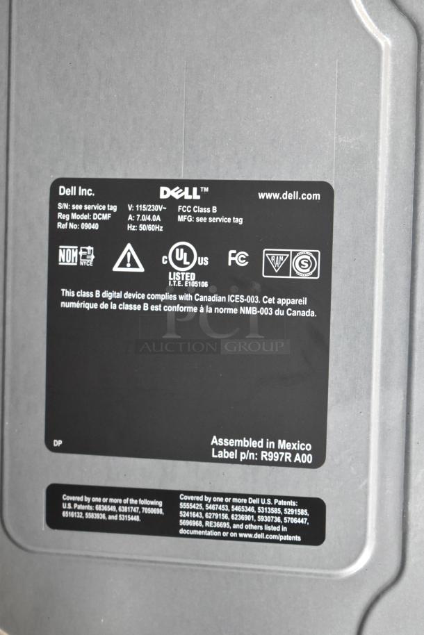 Dell DCMF computer tower, 115/230V, 1 Phase, FCC Class B, UL listed, assembled in Mexico. Model DCMF, includes compliance labels.
