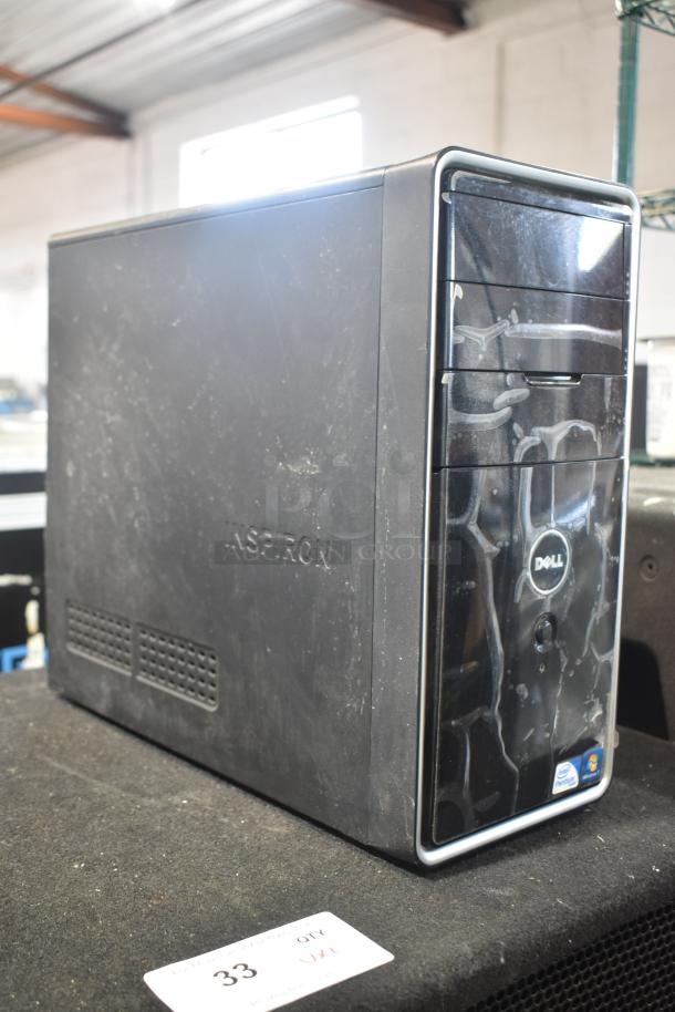 Dell DCMF computer tower, 115/230 volts, 1 phase. Black exterior with visible wear. Dell logo present.