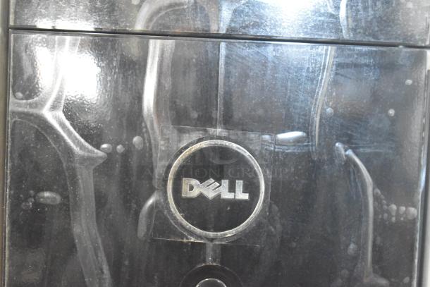 Dell DCMF Computer Tower, 115/230V, 1 Phase, features Dell logo on front panel. Suitable for office or home use.