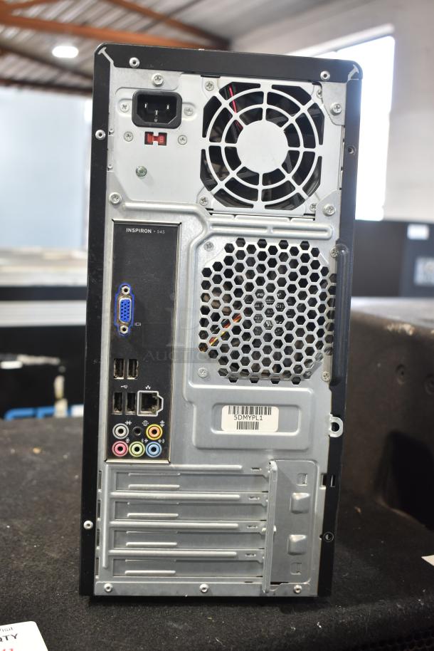 Dell DCMF computer tower, 115/230 volts, 1 phase, rear panel ports visible. Model: Inspiron 545. Tags display barcode: 5DMYPL1.