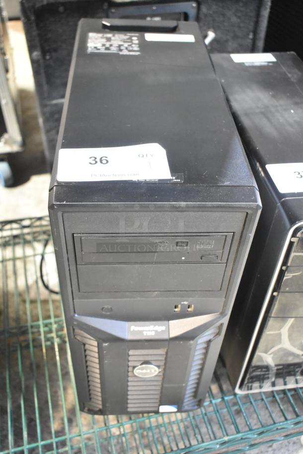 Dell PowerEdge T110 computer tower in good condition, features front USB ports and CD/DVD drive. Auction label visible.