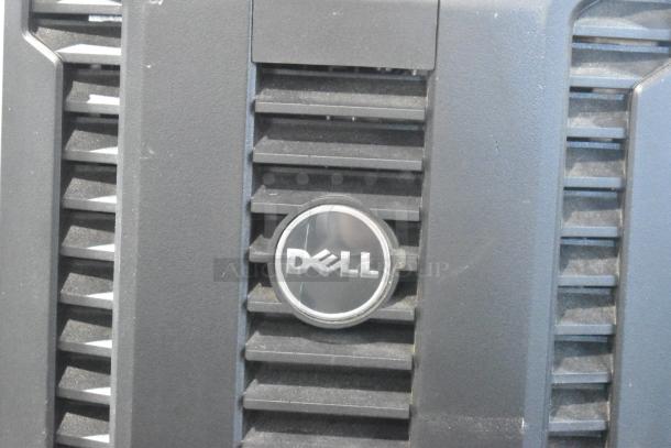Dell computer tower front panel with logo, black color, used condition, dust visible on surface.