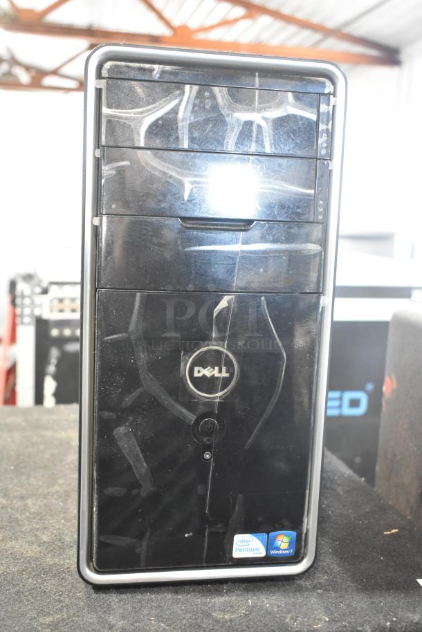 Dell DCMF computer tower, black. Features Intel Pentium sticker and Windows 7 label. 115/230V, 1 phase. Used condition.