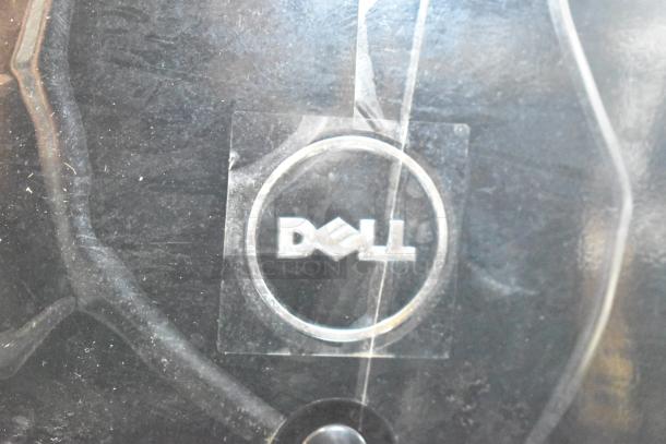 Dell DCMF computer tower in good condition, 115/230 volts, 1 phase; features Dell logo on front panel.