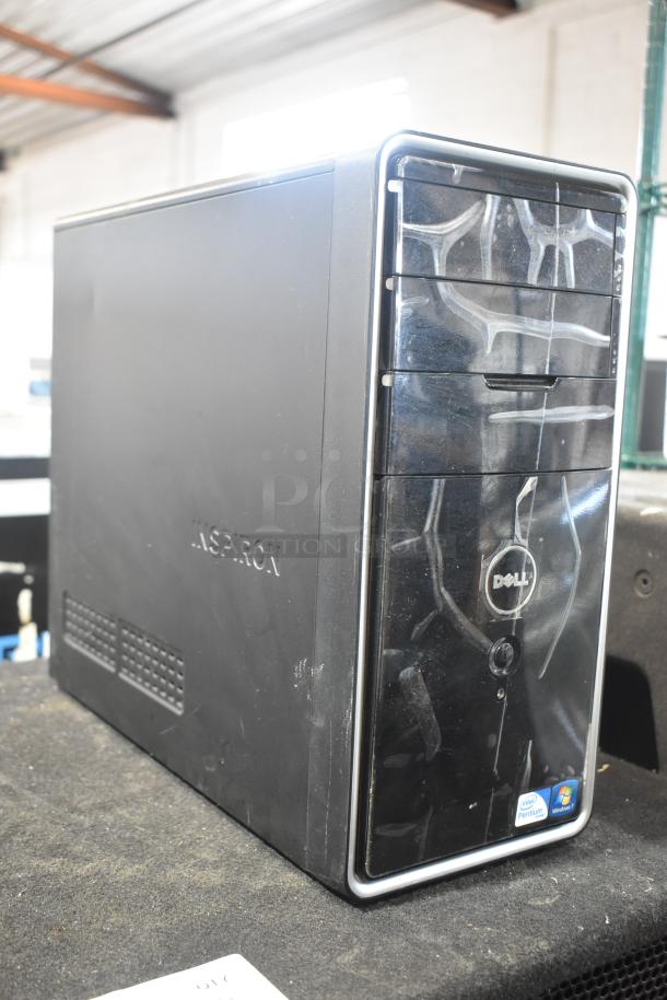 Dell DCMF computer tower, 115/230 volts, 1 phase. Black casing with Dell logo, signs of wear. Model DCMF.