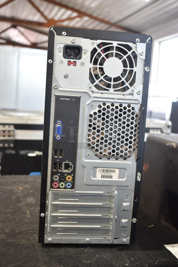 Dell DCMF computer tower, rear view showing power supply, ports, and ventilation. Model DCMF, 115/230V, 1 Phase.