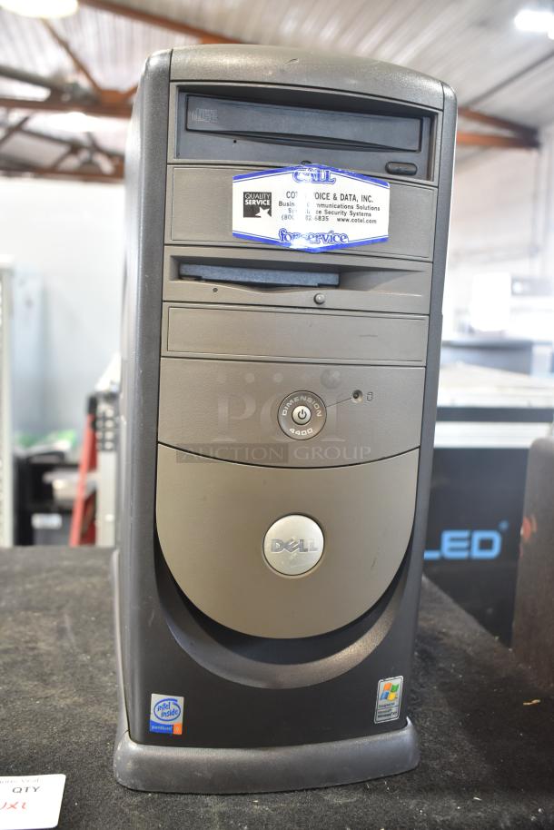 Dell Dimension 4400 computer tower, featuring CD drive and front USB port. Visible labels indicate Pentium 4 processor and Windows XP compatibility.