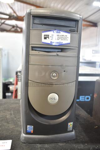 Dell Dimension 4400 computer tower, featuring CD drive and front USB port. Visible labels indicate Pentium 4 processor and Windows XP compatibility.
