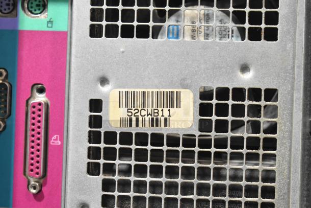 Rear view of Dell computer tower with vintage port connectors and a barcode label numbered 52CWB11.