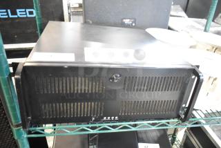 LG rack unit, black, with vented front panel, minor surface wear, mounted on a metal shelf. No visible labels or tags.