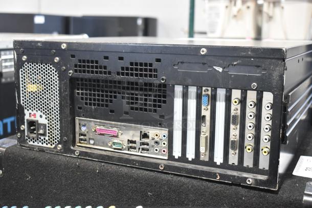 LG rack unit with multiple audio and video ports, connectors, and cooling vents, showing some wear and tear.
