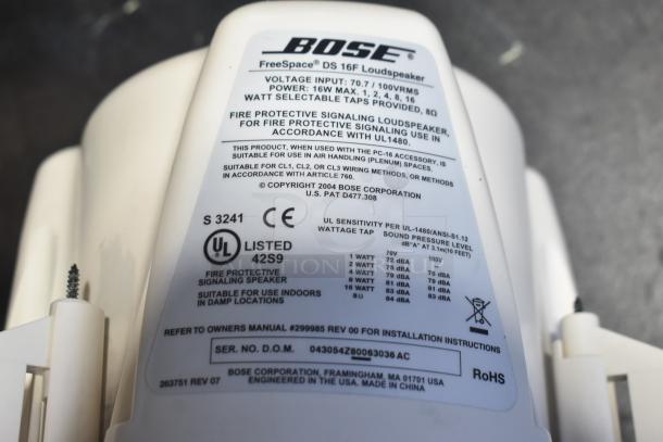 Close-up of Bose FreeSpace DS 16F Loudspeaker label showing technical specifications, certifications, and manufacturing details.