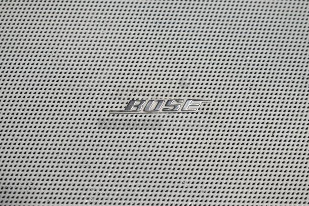 Four Bose FreeSpace DS 16F loudspeakers with metal grilles and Bose logo, pristine condition, ideal for commercial use.