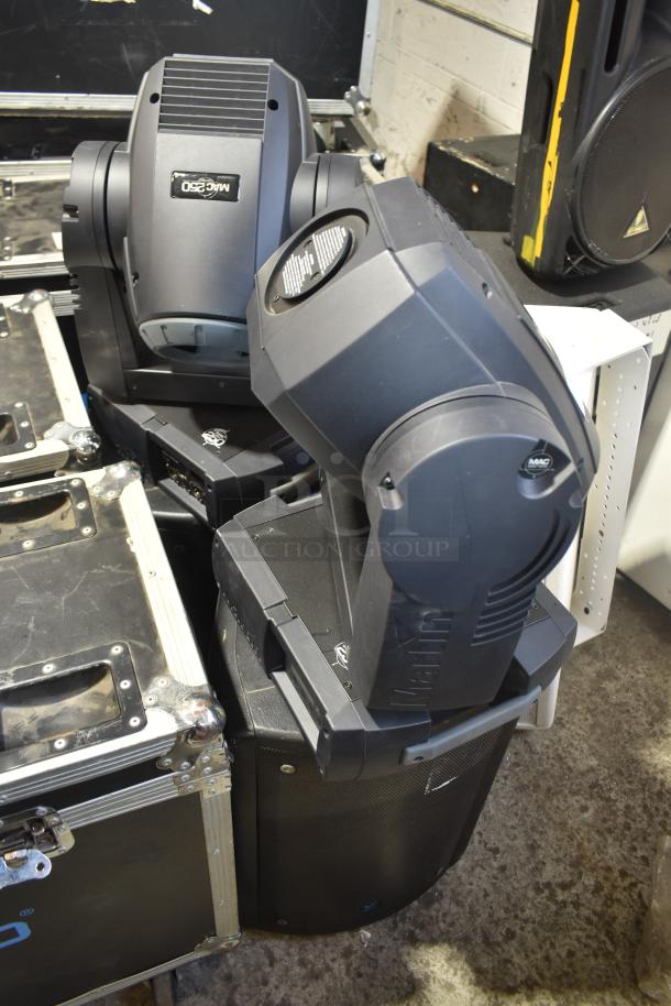 Four items including two Martin MAC250 Entour stage lights and two Yorkville NX520P loudspeakers, in used condition.