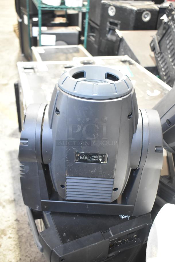 Martin MAC250 Entour stage light with visible surface wear. Includes 2 lights and 2 Yorkville NX520P loudspeakers.