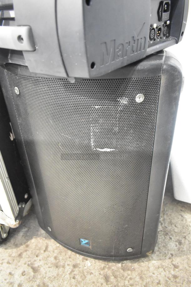 Four-item lot: 2 Martin MAC250 Entour stage lights, 2 Yorkville NX520P loudspeakers. Visible Marks: Martin logo, Yorkville badge.