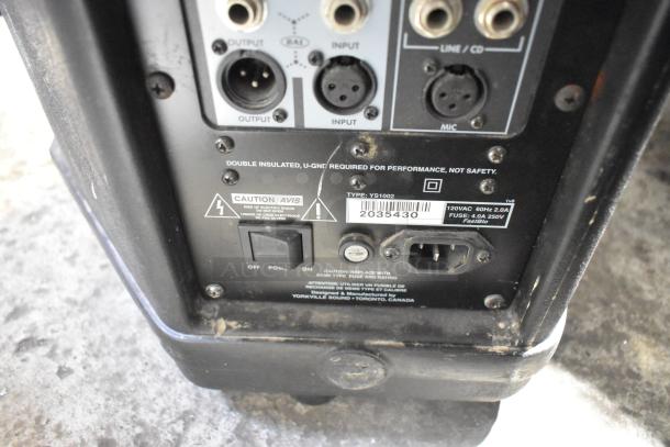 Back panel of a Yorkville NX520P loudspeaker showing input/output ports, power switch, and type label. Model YS1002.
