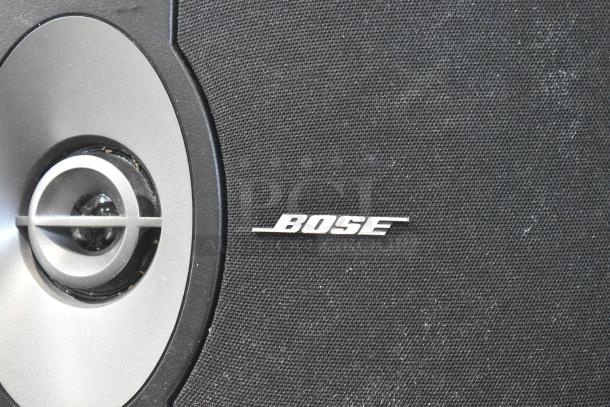 5-speaker set featuring Bose 201 V speaker, black grille with silver cone, Bose logo visible, good condition.