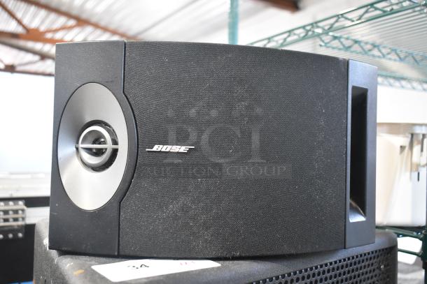Bose 201 V speaker in good condition, featuring a black mesh grille and silver accents. Visible Bose branding.