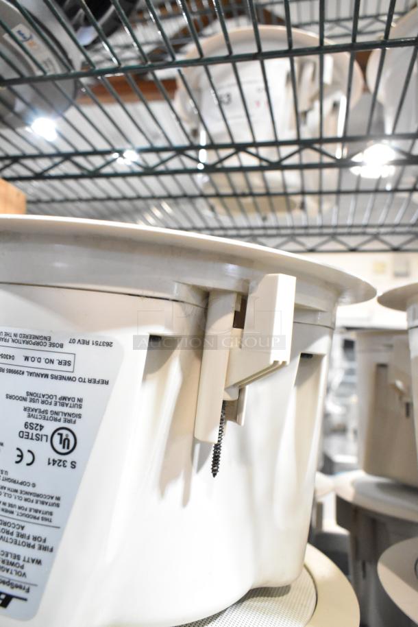 4 Bose FreeSpace DS 16F loudspeakers on shelf, white housing, built for overhead ceiling installation, new condition, CE and UL listed.