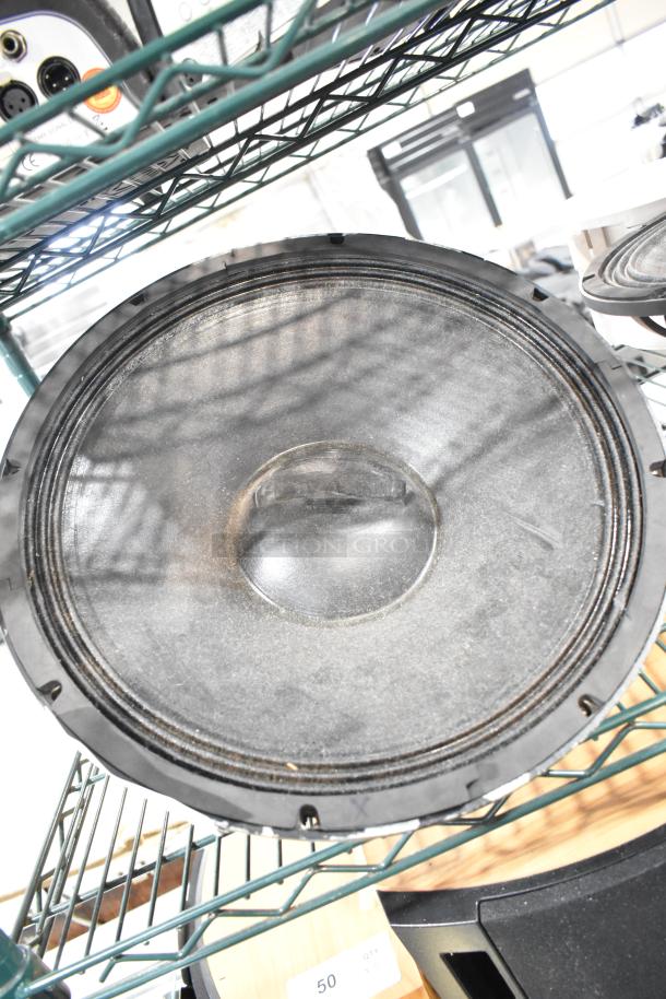 2 speakers including Faital Pro 12HP1030 and Yorkville NX750P, 8 ohm, visible on metal shelving, used condition.