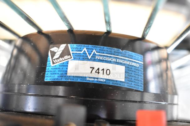 Yorkville NX750P speaker detail with Yorkville logo and model number 7410 on label.