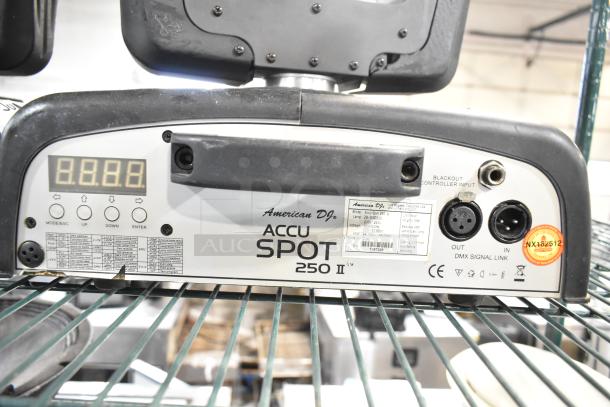2 American DJ Accu Spot 250 II moving head lights, DMX control, displayed label with specs and connections, club stage use.
