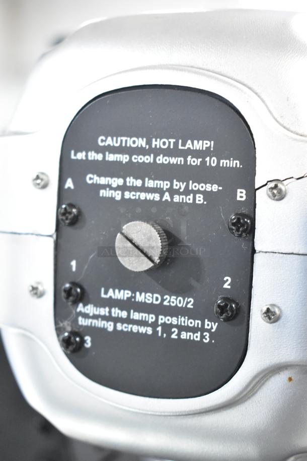 Close-up of control panel on American DJ Accu Spot 250 II, showing lamp adjustment instructions and caution for hot lamp.