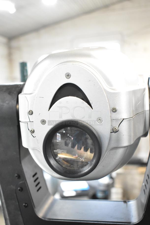 2 American DJ Accu Spot 250 II DMX moving head lights in silver. Features include adjustable angles and durable construction.