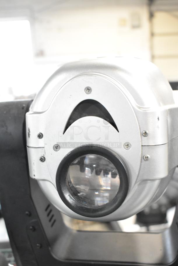 Two American DJ Accu Spot 250 II DMX moving head lights, silver casing, professional stage lighting, shown in used condition.