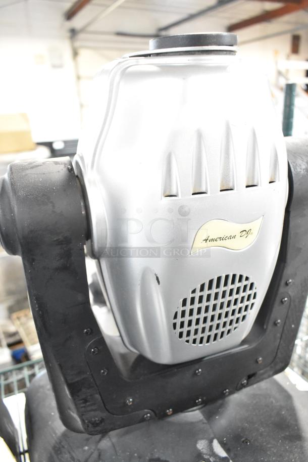 2 American DJ Accu Spot 250 II stage lights, DMX compatible, silver body, "American DJ" label, good condition.