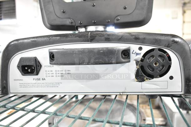 2 American DJ Accu Spot 250 II Moving Head DMX Lights, power input panel close-up, shows usage wear and labels.