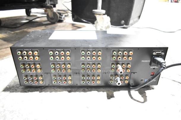 Xantech 8X8 HD Component Video Switcher back panel with multiple RCA input/output ports, power cable attached.