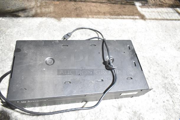 Altronix R2416300ULCB power supply with visible wiring, black casing, and multiple connection points; slight wear.