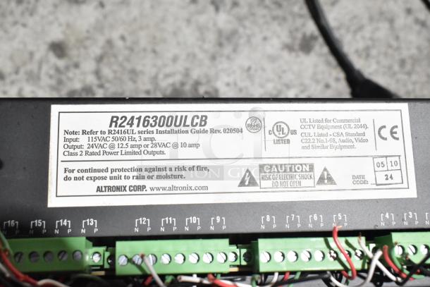 Altronix R2416300ULCB power supply label, detailing input/output specs, safety warnings, and UL listings.