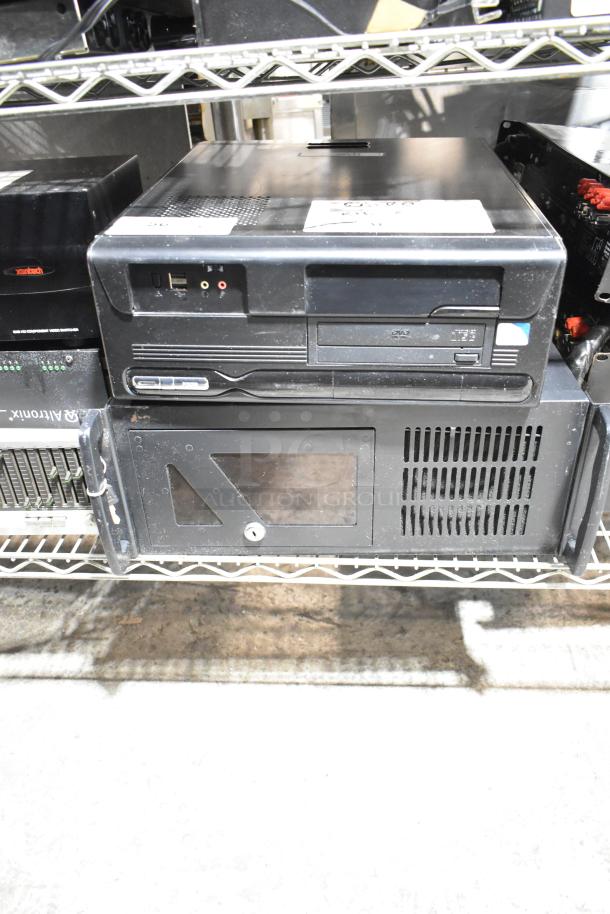 DVD playing unit and LG rack unit on metal shelf; visible ports and labels indicating model numbers, minor wear.