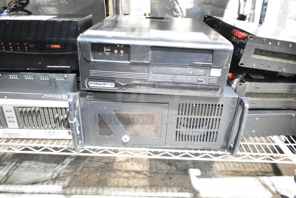 DVD playing unit and LG rack unit on a metal shelf. Visible ports and DVD drive indicate connectivity options.