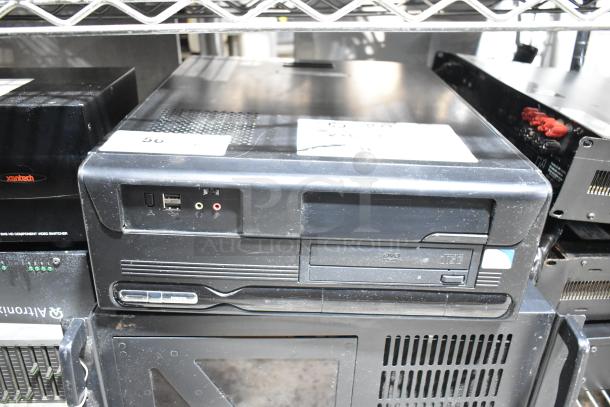 DVD player and LG rack unit with front USB and audio ports, visible wear. Includes label "50". Ideal for home entertainment.
