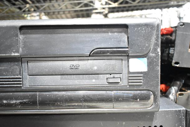 DVD playing unit and LG rack unit, both with visible wear. Features DVD and compact disc logos on the front panel.