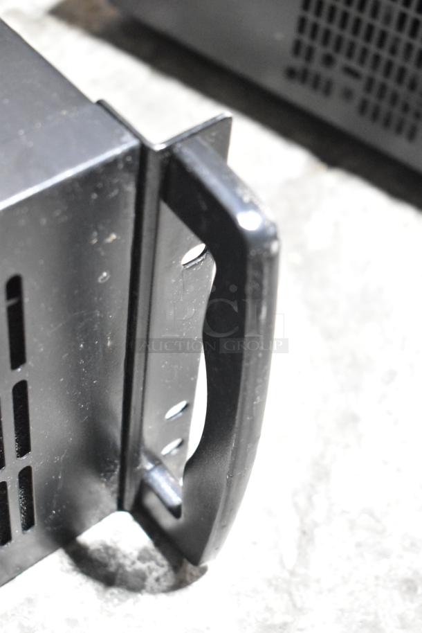 DVD player and LG rack unit with handle, black metal, used condition, vented design for airflow.