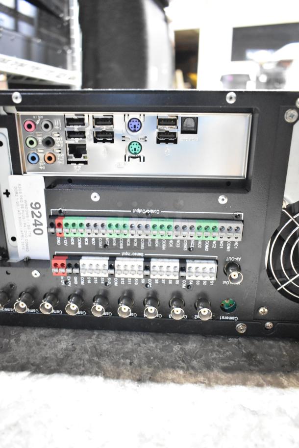 DVD playing unit and LG rack unit with multiple input/output ports, connectors, and internal fan. ID tag: 9240.