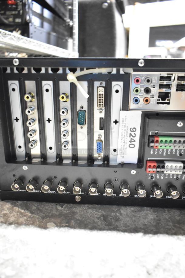 DVD playing unit and LG rack unit with various input/output ports. Includes visible label indicating specs: ASUS M4N68T-M V2.