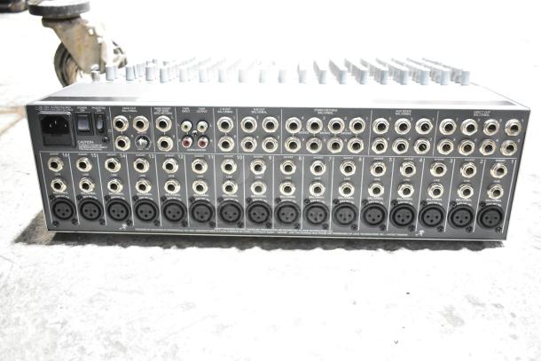 Mackie 1604-VLZ3 Premium Mic/Line Mixer, 16 channels, numerous input/output jacks, good condition, rear view.