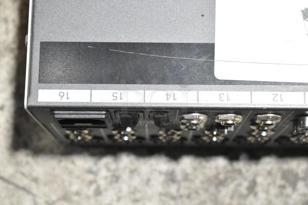 Mackie 1604-VLZ3 Premium Mic/Line Mixer, close-up of numbered input channels, showing slight scratch, used condition.