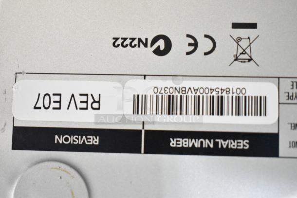 Barcodes and labels on a Mackie 1604-VLZ3 mixer with revision E07 noted. Serial number 0018454. CE markings visible.