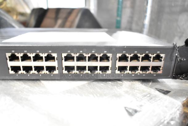 Dell PowerConnect 2024 Switch with 24 Ethernet ports, part of a 4-item auction lot.