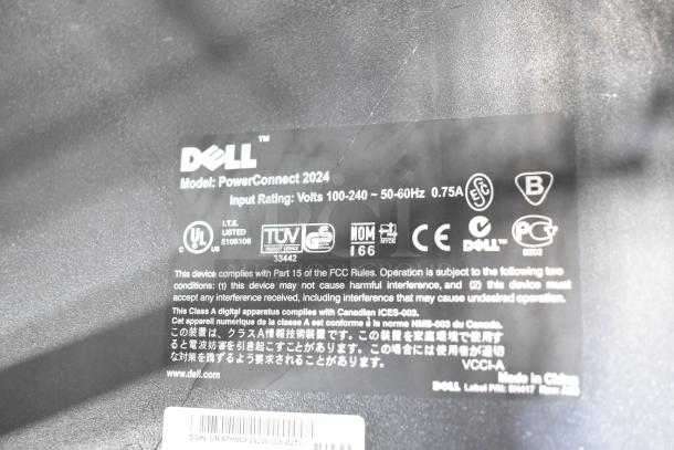 Dell PowerConnect 2024 label; details include input rating (Volts 100-240, 50-60Hz, 0.75A) and compliance certifications.