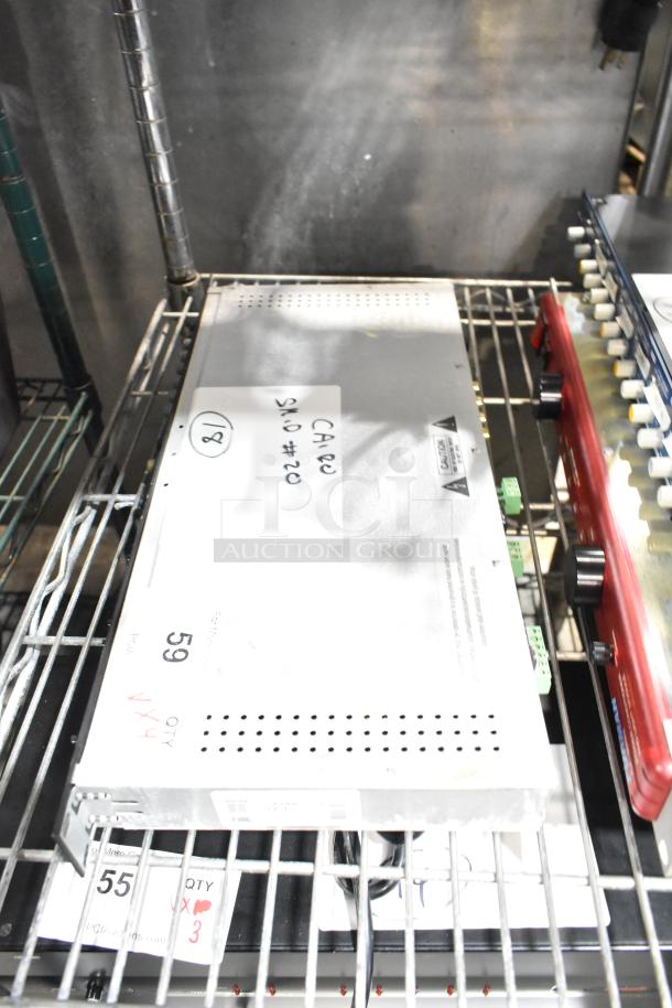 Four electronic items on a shelf: Dell PowerConnect 2024 switch, Rane CP 64S processors, Alto Link Splitter Mixer, Furman PLP power conditioner. Tags and markings shown.